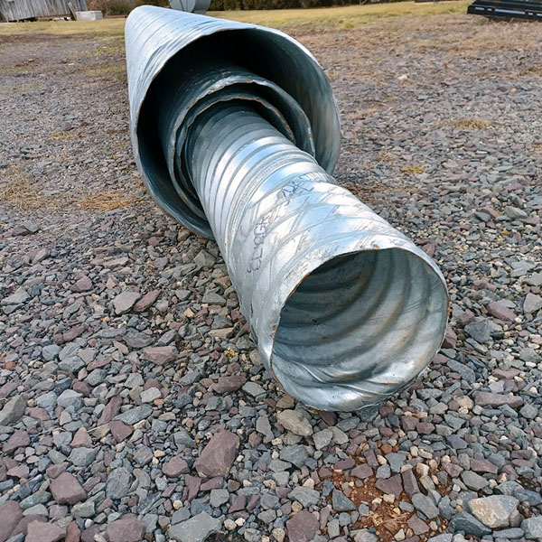 Multiple sizes of galvanized culvert pipe.