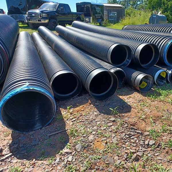 Multiple large diameter HDPE culvert pipe.