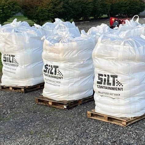 Bags of Silt Containment Silt Socks on pallets.